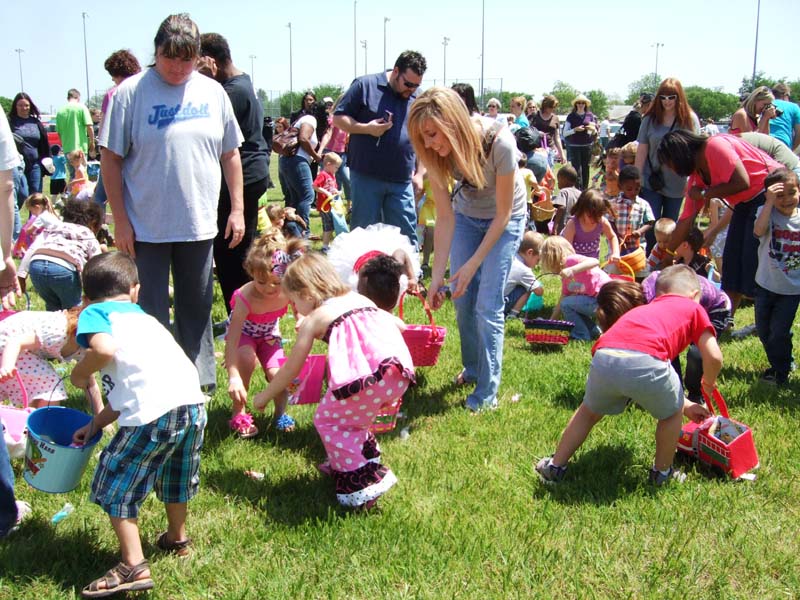 photo of kids and parents hunting for eggs